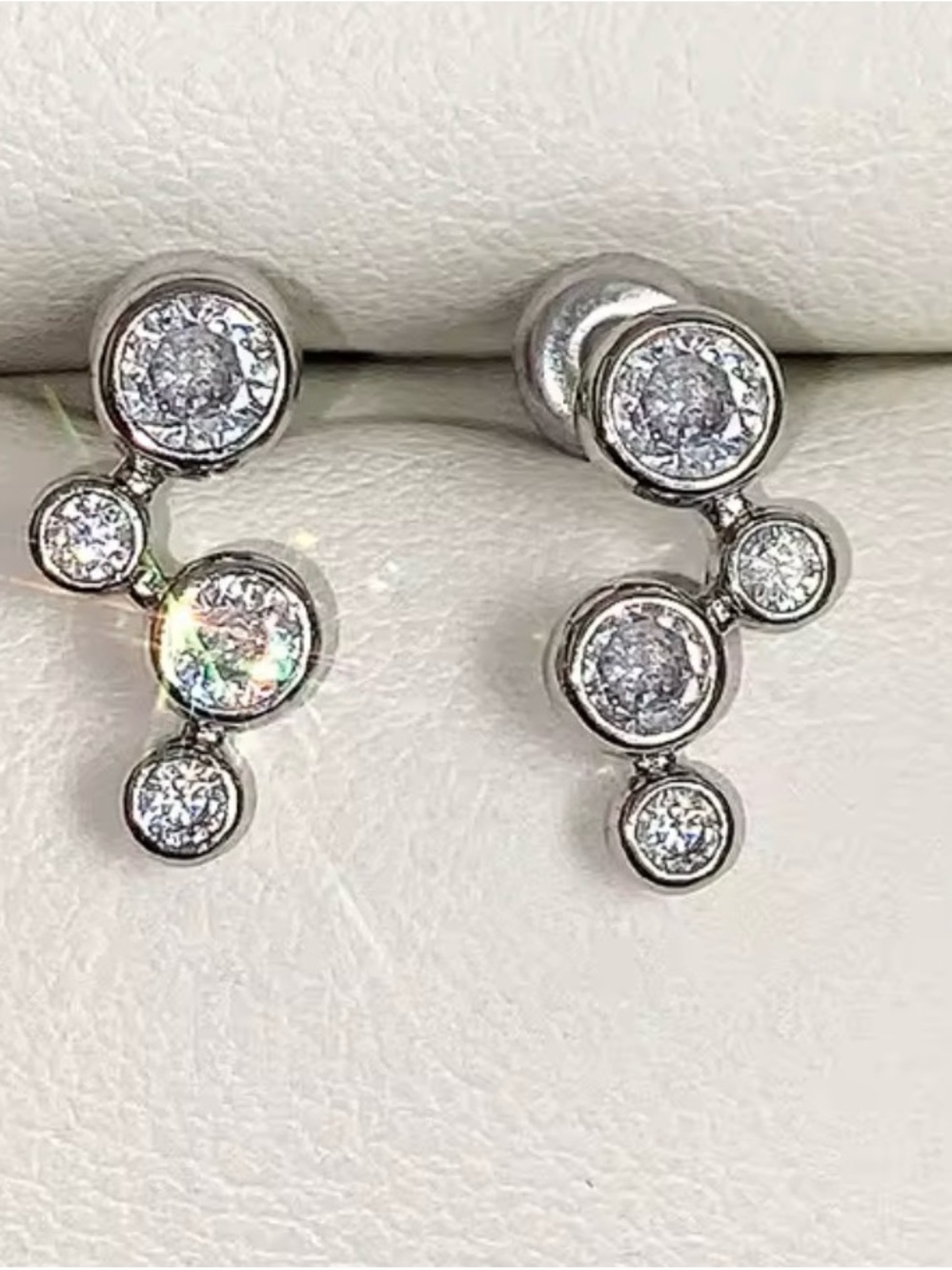 Sterling Silver sparkling diamond cluster asymmetrical small circular earrings